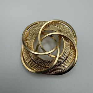 Vintage gold tone geometric swirl brooch